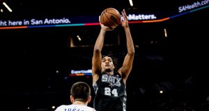 Devin Vassell shoots over Ivaca Zubac in the first meeting of Spurs vs Clippers at the AT&T Center