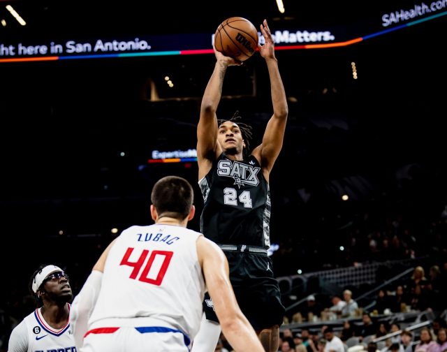 Devin Vassell shoots over Ivaca Zubac in the first meeting of Spurs vs Clippers at the AT&T Center