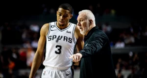 Spurs Keldon Johnson talking with Coach Pop in the Heat game